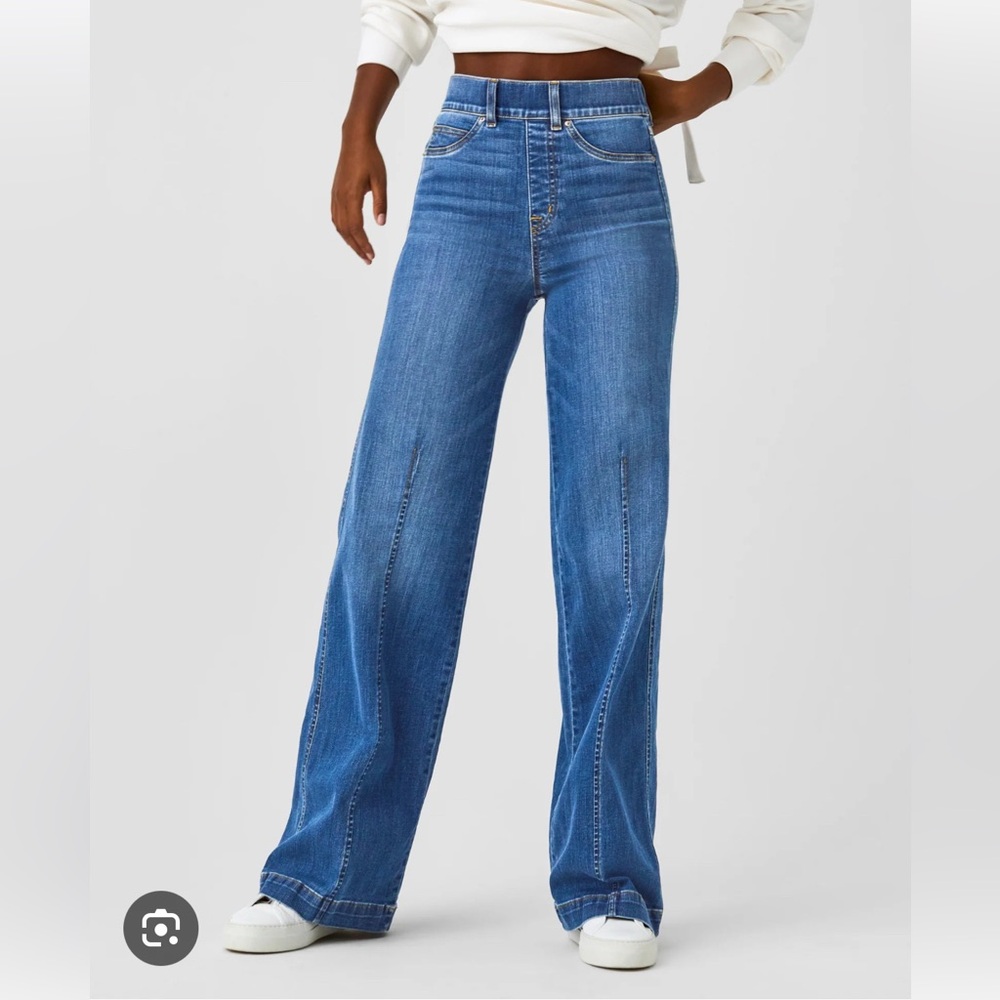 SPANX Everywhere. Blue Flare Wide Leg Jeans front seam.
